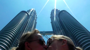 MALAYSIA: Smoochin' in front of the Petronas Towers in Kuala Lumpur. Probably illegal.