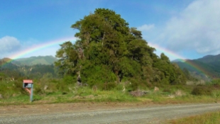 LAOS: Chasing the end of the rainbow in a tuk tuk.